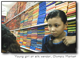 Girl at silk vendor
